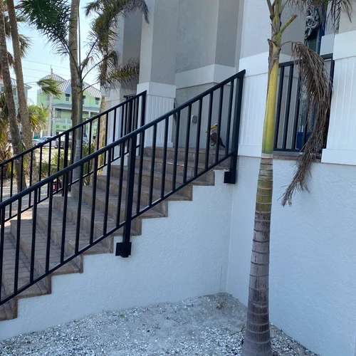 Railing for steps leading up to a beautiful home in Southwest Florida.